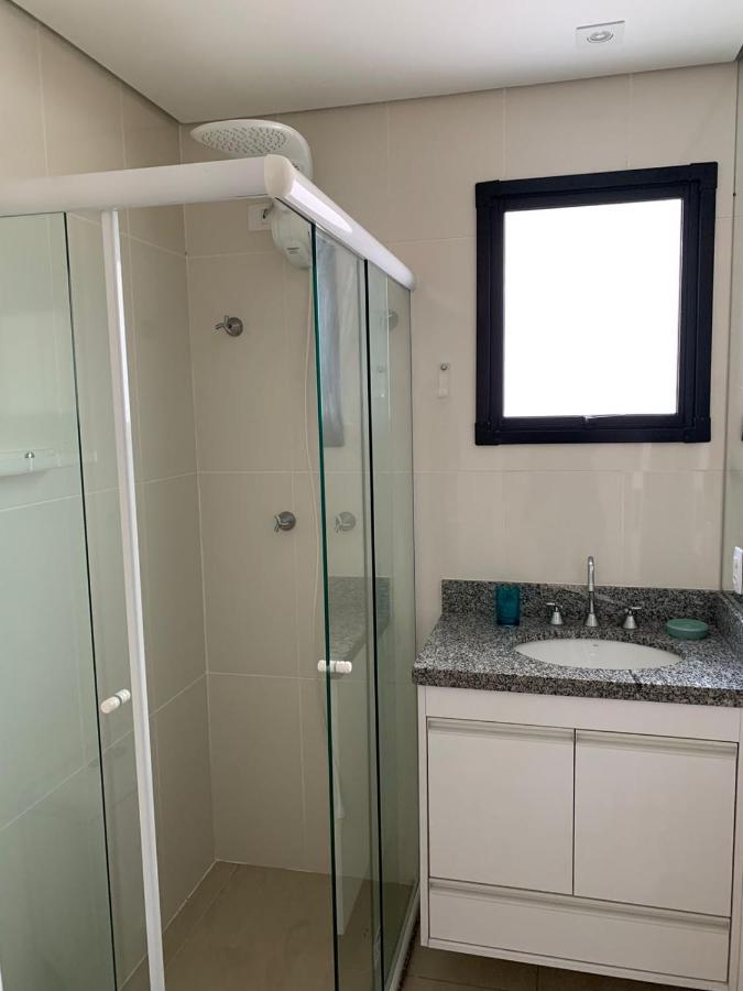 Appartamento Flat em Pitangueiras - sacada gourmet, 3 dorms, limpeza diária e serv de praia Guarujá Esterno foto